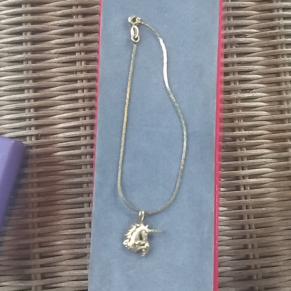 7" 14 karat gold bracelet with unicorn charm